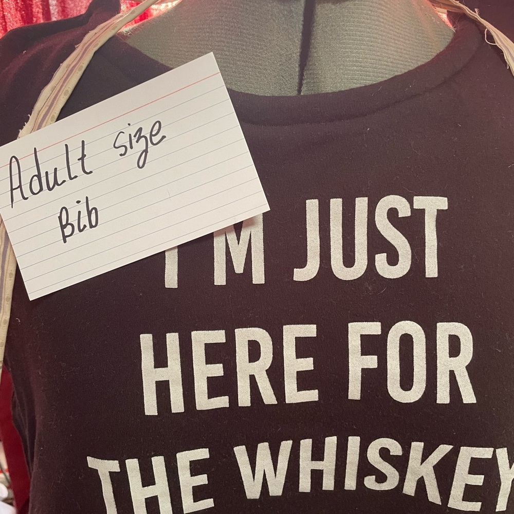 Black Adult Size Bib with White Text I am here for the whiskey